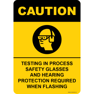 G Signage - "Testing In Process Safety Glasses And Hearing Protection Required When Flashing" - EN - OSHA Caution Sign